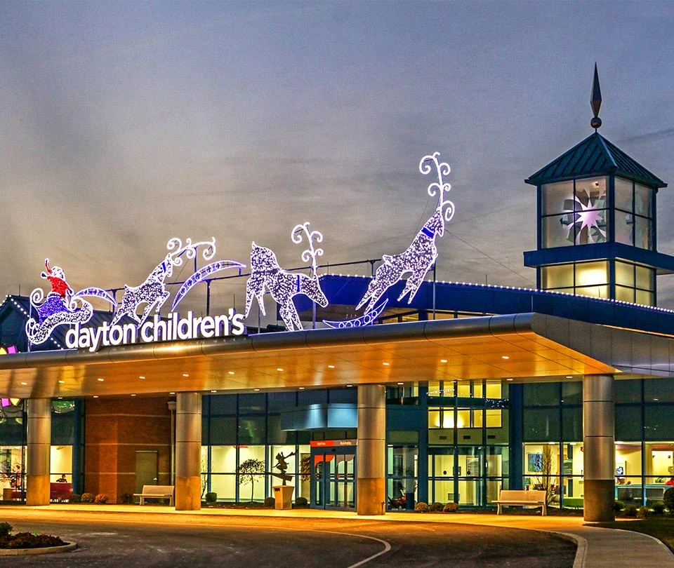 Lit sleigh and reindeer display on the entrance canopy of Dayton Children's Hospital