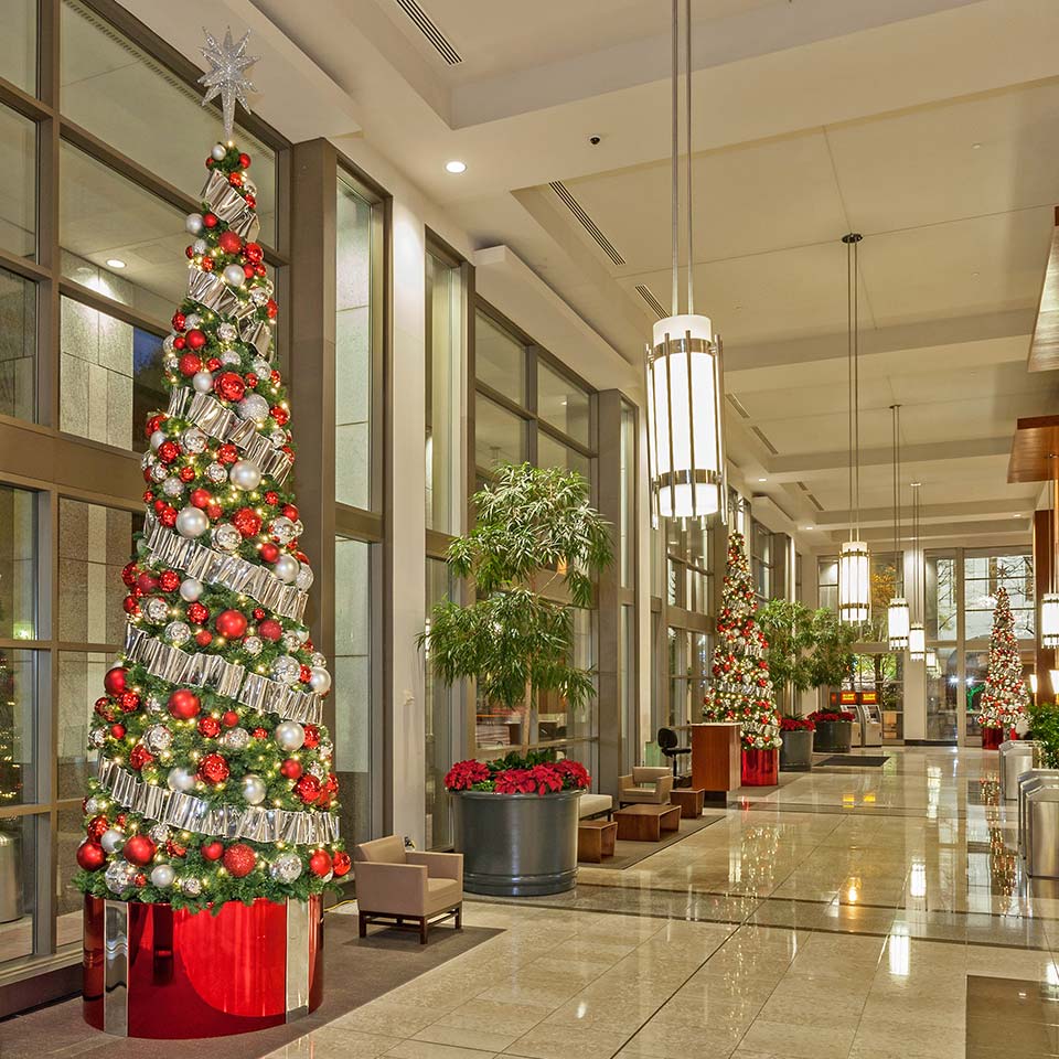 Tall Christmas tree in the lobby of a campus building