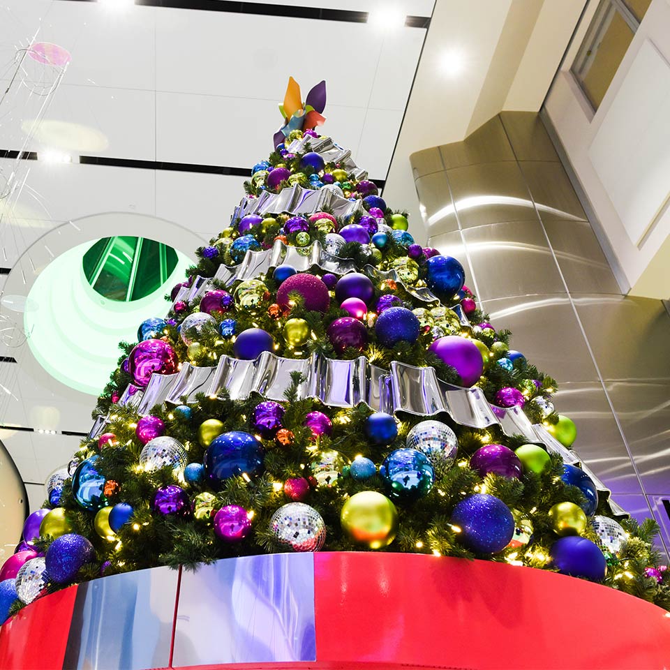 Christmas tree with colorful ornaments in a hospital atrium