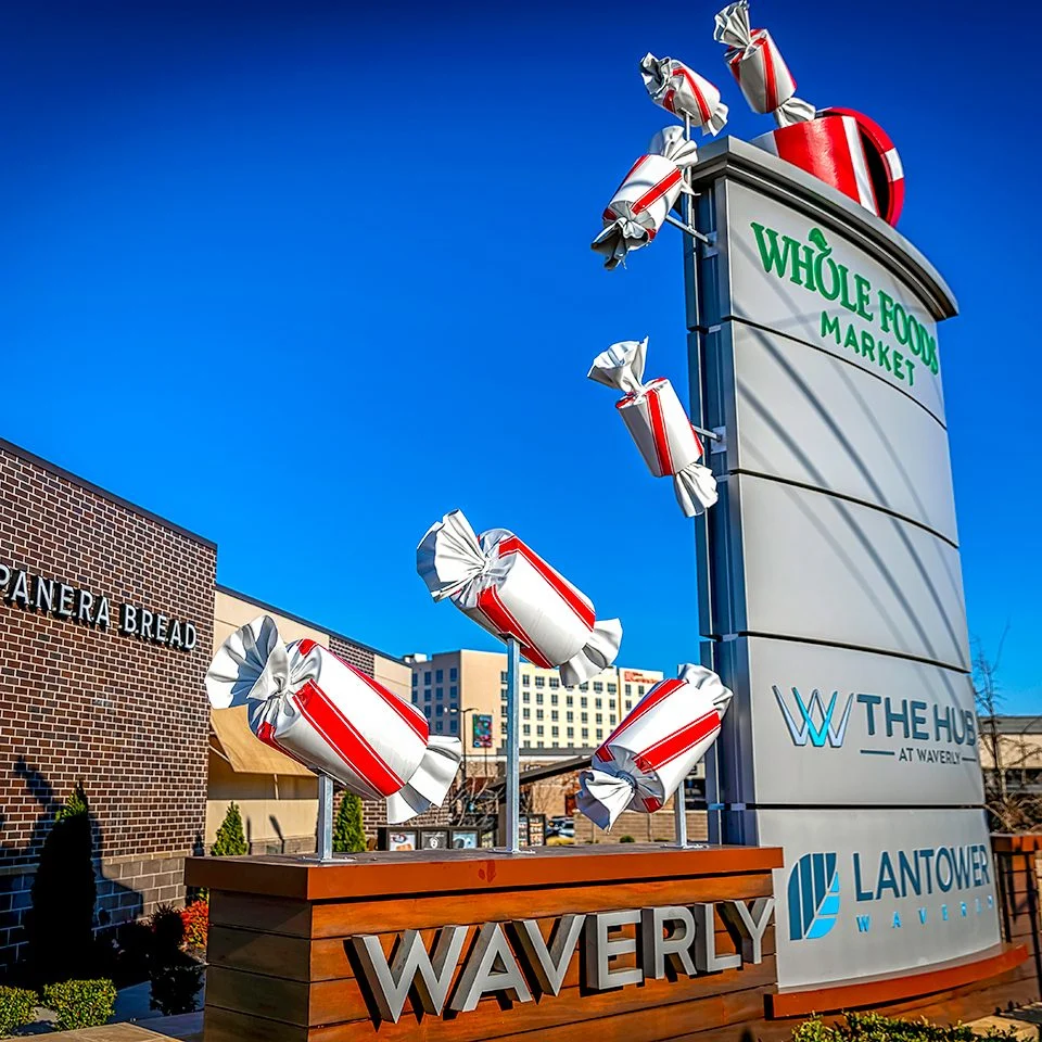Giant 3D Christmas Decoration Candies Fall From Whole Foods Shopping Center Monument Sign